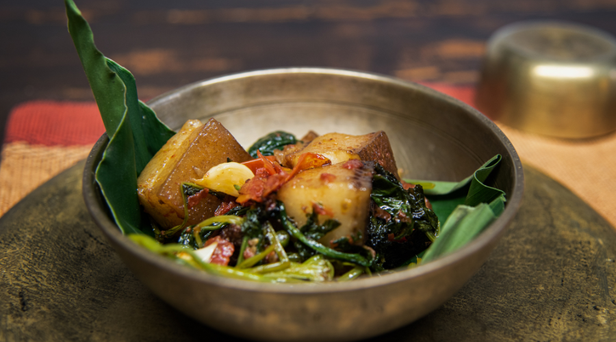Gitika Saikia’s smoked pork with laai haak (mustard leaves). Photo Credits: Yasmin Khambatta